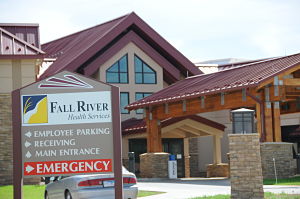 Picture of the hospital front entrance, with the Fall River Health service sign